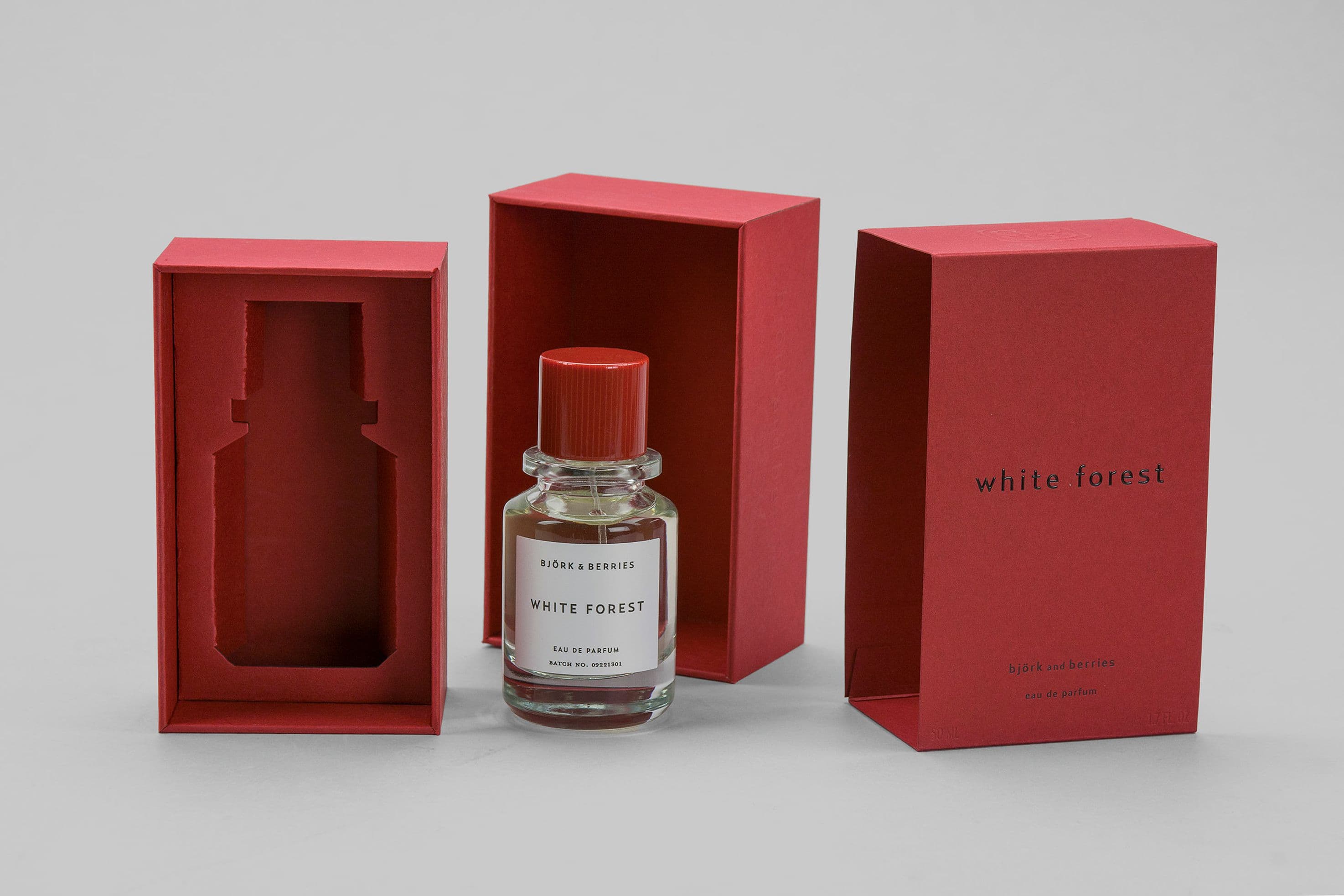 red rigid boxes with foil stamping made for perfume bottles