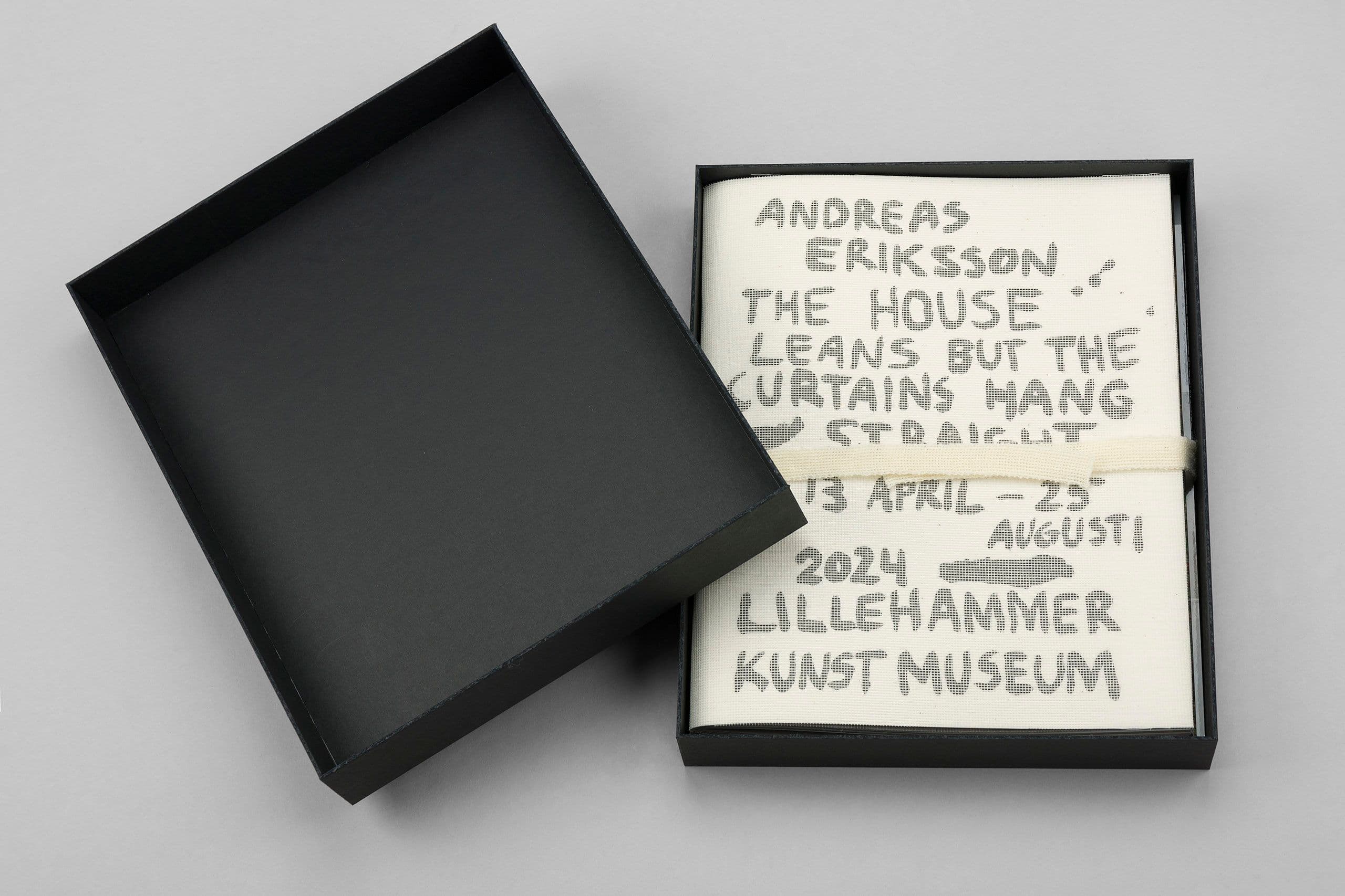Exhibition catalogue in a black rigid box