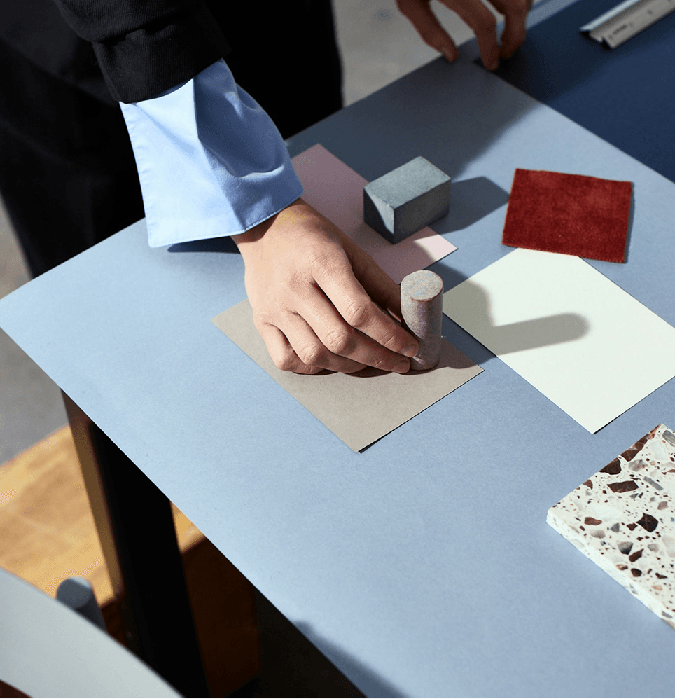 Hand holding a color example, designing