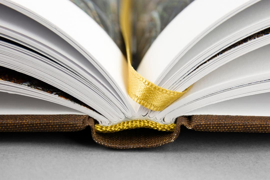 Closeup hardcover book with H&T