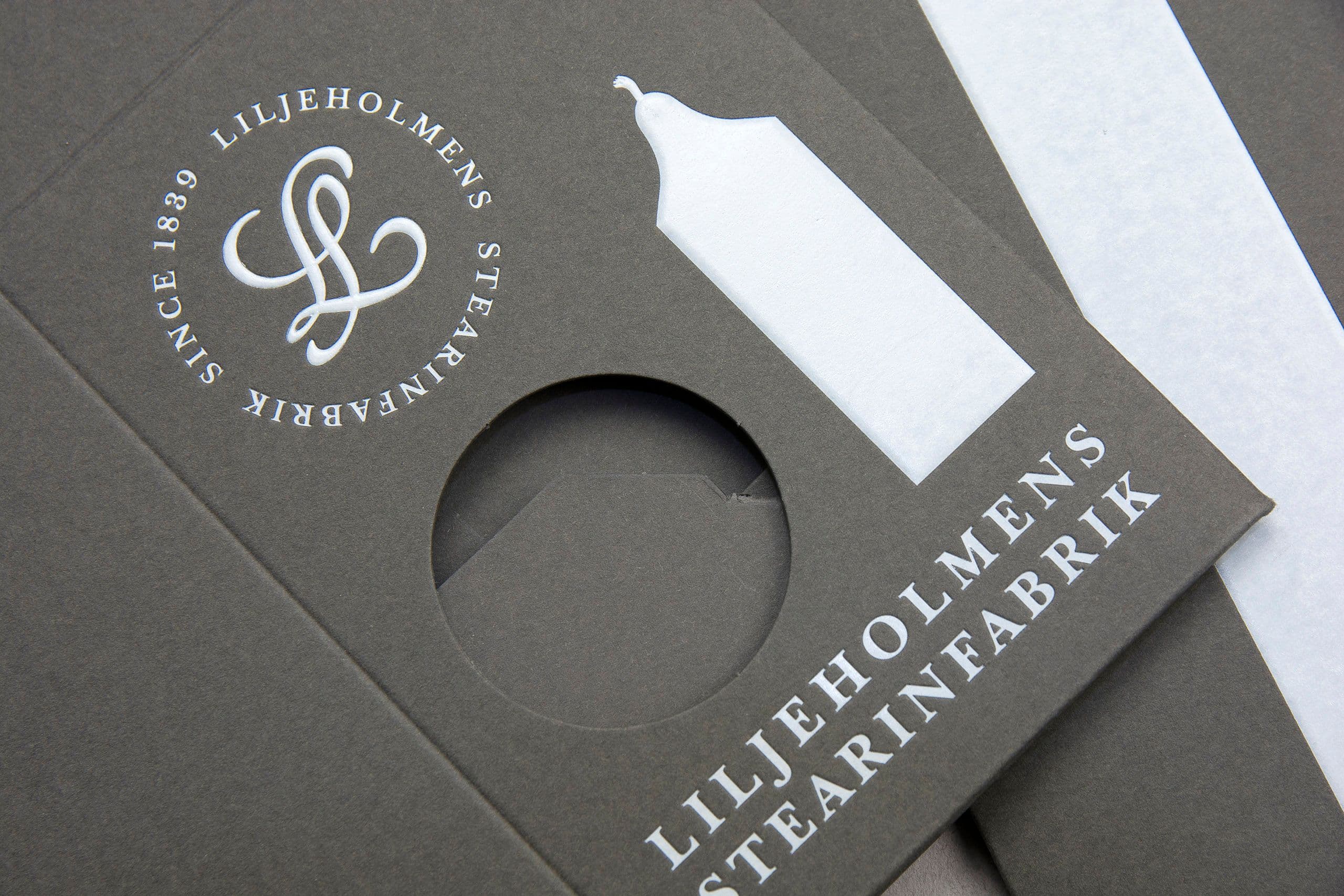 Gray folding boxes for candles with foil stamping and die-cutting