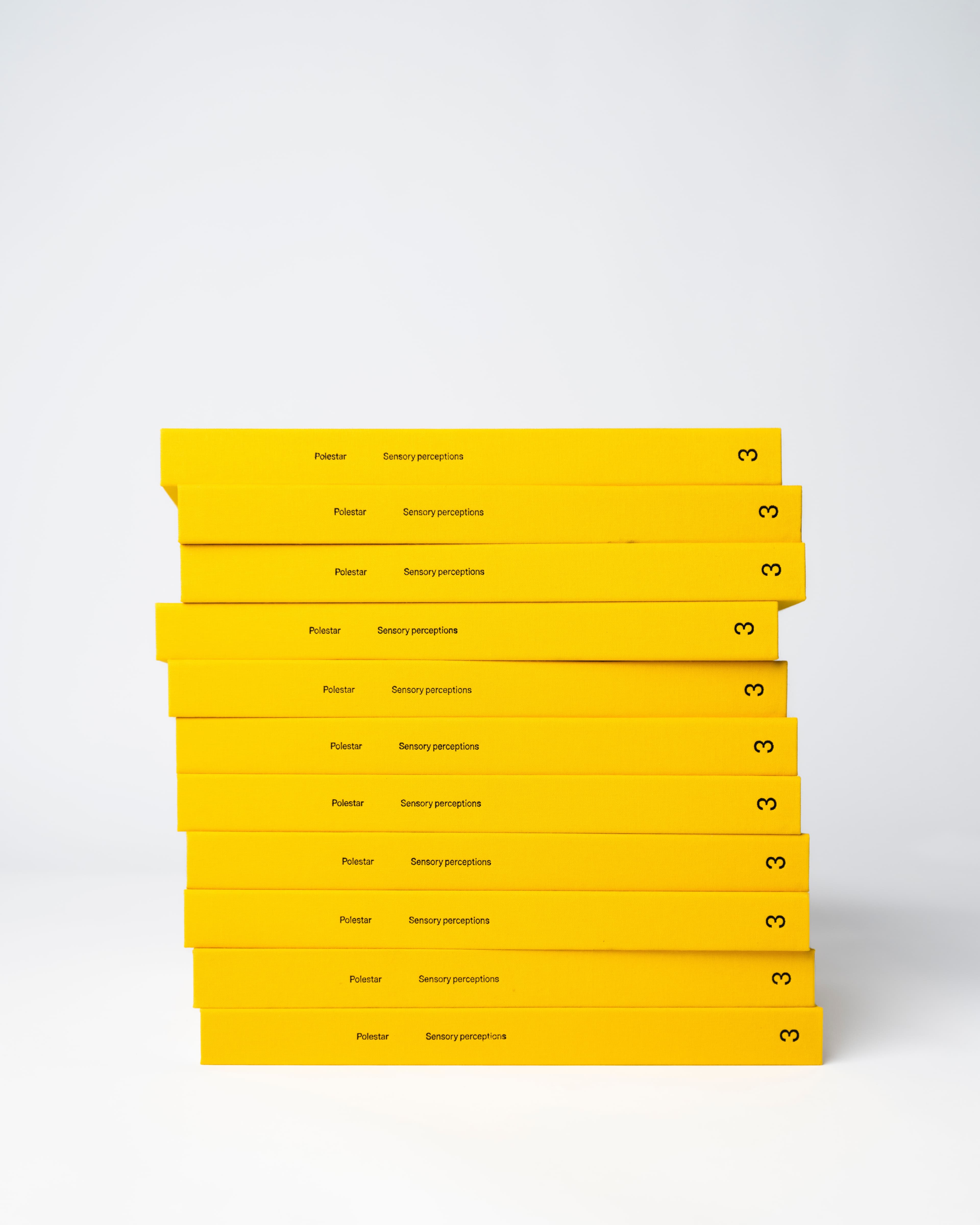 Stack of custom-branded rigid presentation boxes in vibrant yellow, showcasing premium print and packaging craftsmanship. The image highlights precision box manufacturing, high-quality color consistency, and clean logo application—ideal for luxury retail packaging, product launches, corporate gifting, and branded marketing kits. A strong example of multi-solution print and packaging services, combining structural design, custom finishes, and high-impact brand presentation.