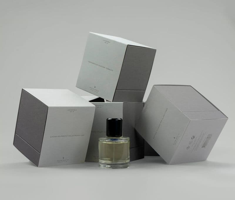 Exclusive rigid boxes for perfumes with a foil stamped sleeve.